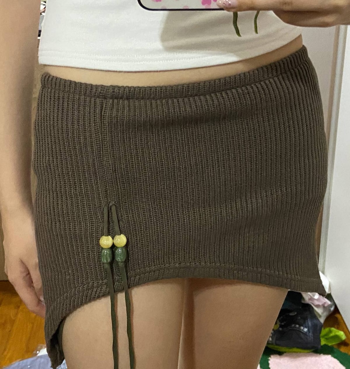 asymmetrical brown knit mini skirt with beaded detail