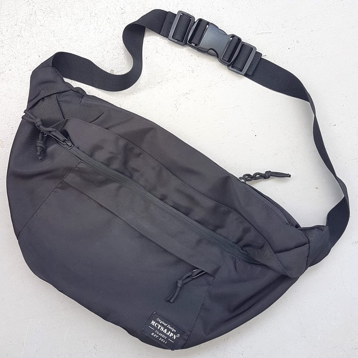 Original MYSC & JPN Crossbody Bag, Cosmopolitan, Classic Black Nylon Bag, Continental, Intricate Design, Fanny Pack, Sleek Design, Cool Sling Bag, Travel Pack, Sophistication, Urban Style, Streetwise, Timeless Appeal, Pop Culture, Cult Street Fashion