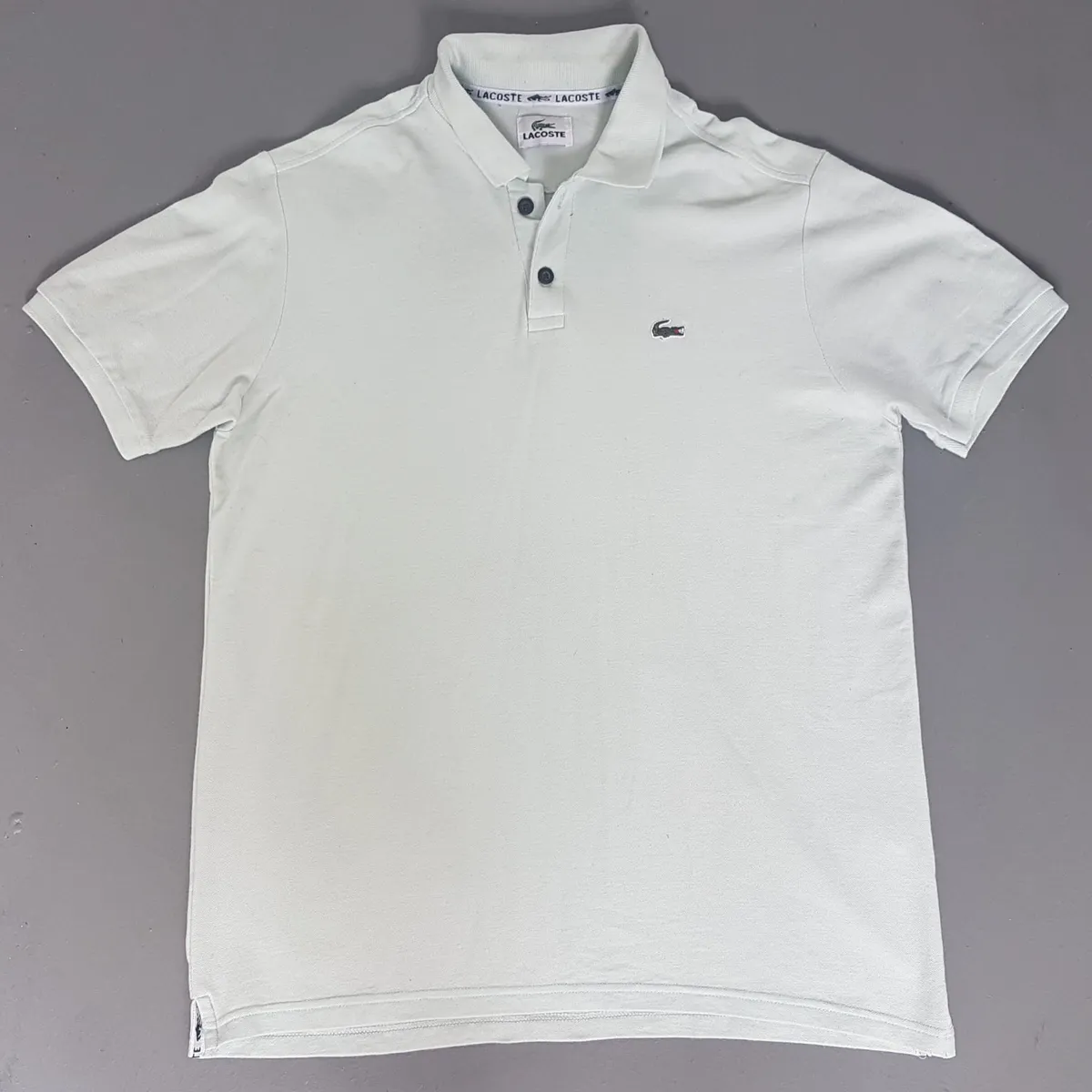Premium LACOSTE Polo Shirt, Paris, Versatile Light Green Top, Classic 2 Buttons Shirt, Cool FRENCH Design, Cosmopolitan, Urban Style, Sophistication, Timeless Appeal, Pop Culture, Summer Holidays, Resort Living, Cult Street Fashion