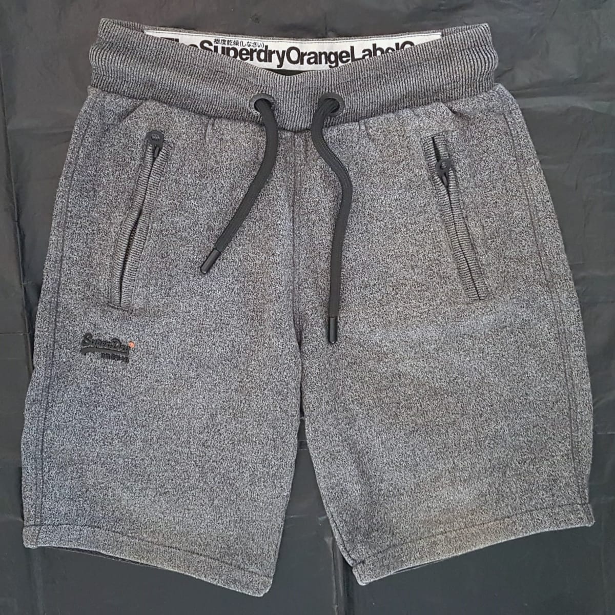 Original Superdry Designer Shorts, Cool Gray Sweatpants, Cosmopolitan, The Superdry Orange Label Co, Sleek Slim Fit Model, XS Bottoms, Luxury Lifestyle, Timeless Appeal, Urban Style, Sophistication, Streetwise, Pop Culture, Geek, Cult Street Fashion