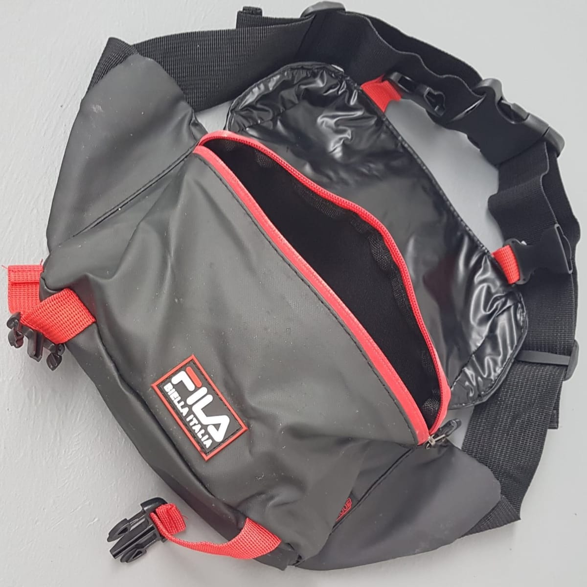 Original FILA Waist Pouch, BIELLA ITALIA Model, Cool Fanny Pack, Cosmopolitan, Black with Red Accents, Waterproof Belt Bag, Cross-Body Bag, Clutch, Satchel, Intricate Design, Sophistication, Luxury Living, Pop Culture, Cult Street Fashion, Timeless Appeal