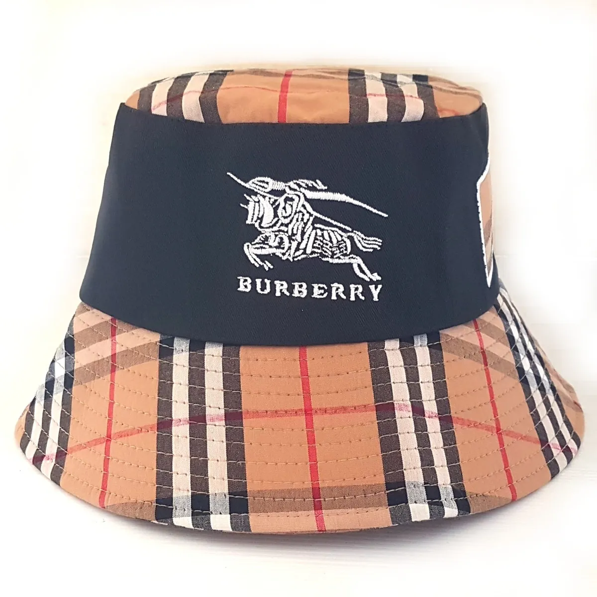 Retro Burberry Bucket Hat, Cool Top, Embroidered Equestrian Knight, Signature Archival Beige Check Pattern, Cosmopolitan, Luxury Living, Sleek Designer Model, Sophistication, Art Décor Cap, Timeless Classic, Pop Culture, Cult Street Fashion, Urban Style