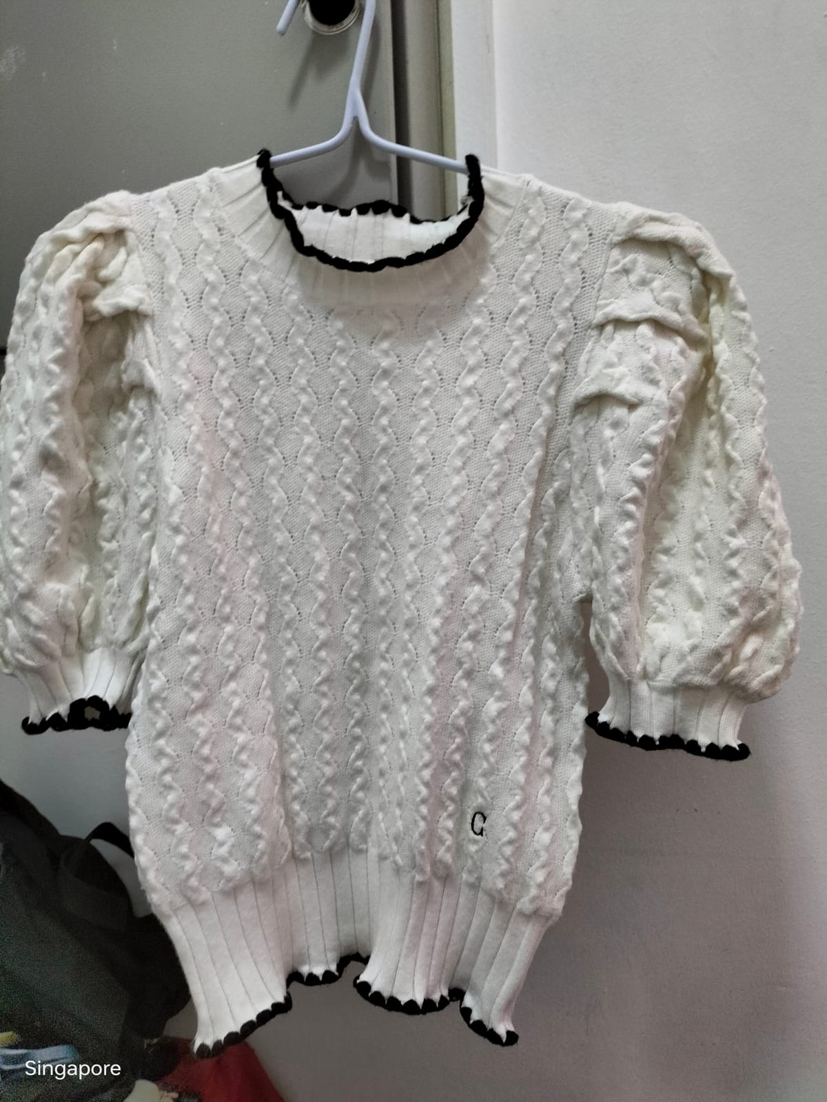 Chic White Knit Sweater with Ruffle Trim
