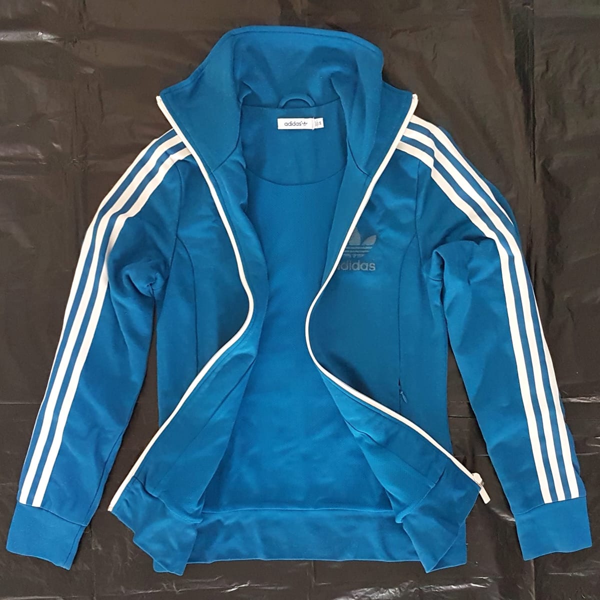Adidas Vintage Adidas Tracksuit, Retro Sky Blue Zipper Jacket, Cosmopolitan, High Collar Coat, Cool Biker Jacket, Sleek ADIDAS Outerwear, Sophistication, Roadster, Travel Essentials, Backpackers, Streetwise, Pop Culture, Geek, Cult Street Fashion