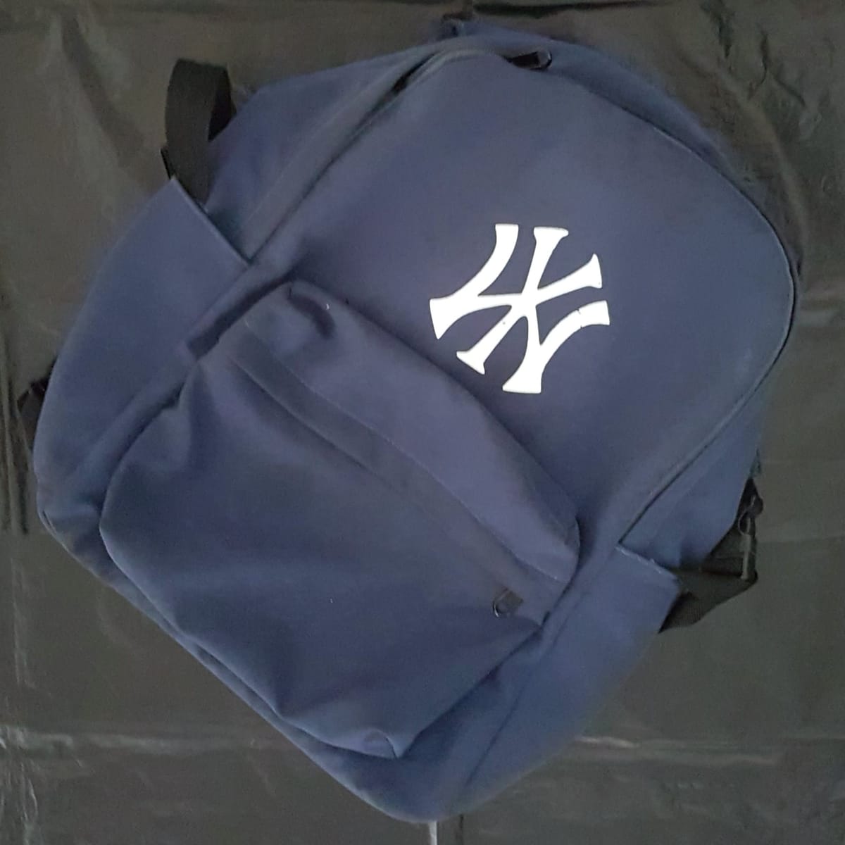 Premium Navy Blue Backpack, Cosmopolitan Rucksack, White Logo Model, Cool Haversack, Travel Pack, Continental, Sleek Design, Laptop Bag, Inspirational, Sophistication, Urban Style, Streetwise, Roadster, Timeless Appeal, Pop Culture, Cult Street Fashion