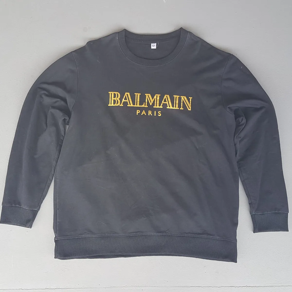BALMAIN BALMAIN Paris Pullover, Black Sweater, Gold Accents, Pierre Balmain Luxury House, Cosmopolitan, Trendy LARGE Jumper, Cool Outerwear, Sleek Designer BALMAIN, Timeless Appeal, Urban Style, Sophistication, Travel Essentials