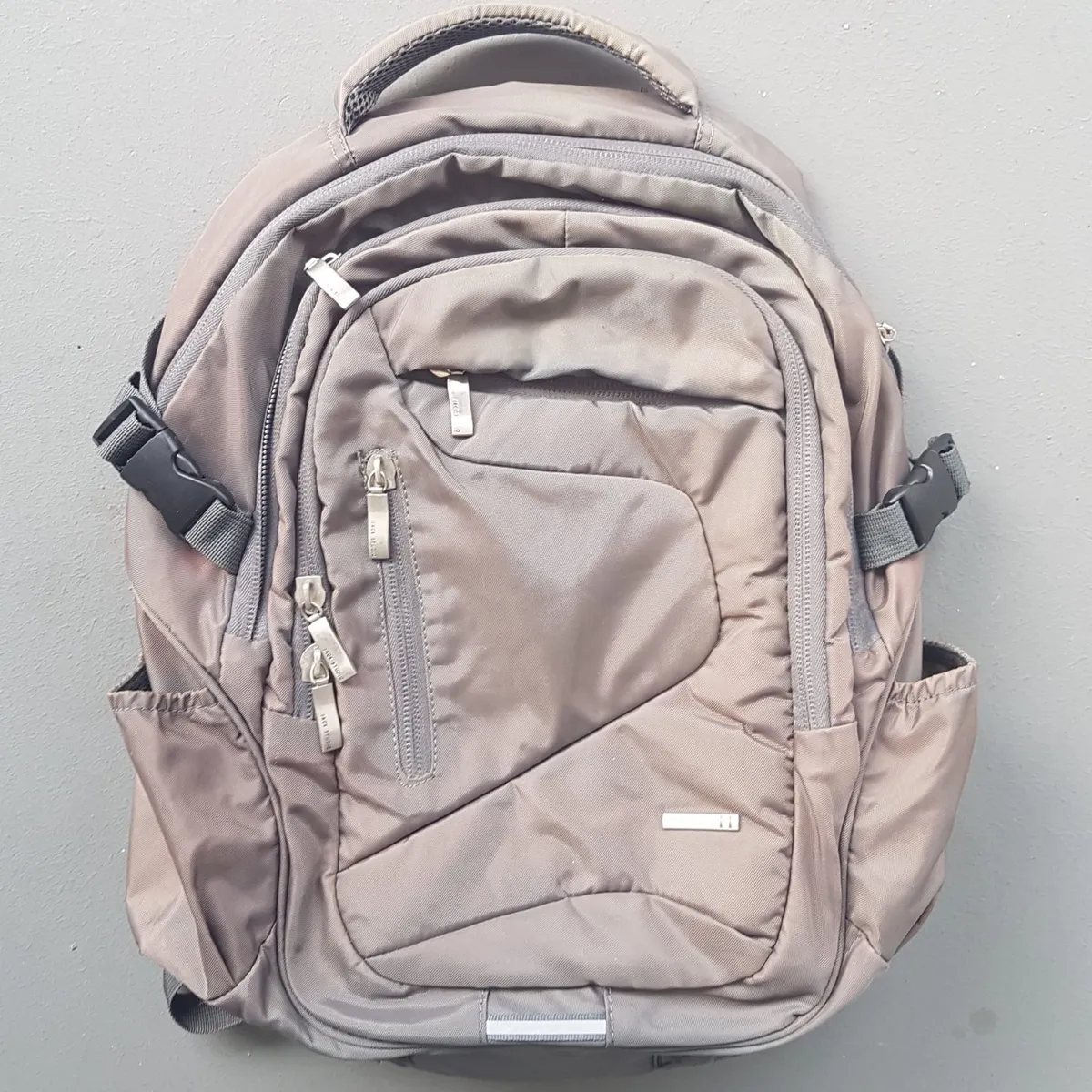 Jack Studio Original JACK STUDIO Backpack, Cool Taupe Gray Haversack, Cosmopolitan, Waterproof, Multiple Compartments, Multiple Zippers, Multi-Tier Organizational Pockets, Side Compression Buckle, Laptop, Travel Pack, Everyday Bag, Sophistication, Streetwise