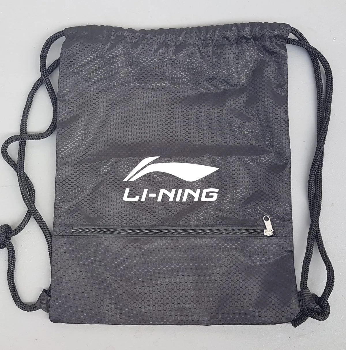 LI-NING Original LI-NING Drawstring Bag, Sporty Black Backpack, Geometric Hexagon Texture Pattern, Front Zipper Pocket, Waterproof Model, Multi-Functional Carrier, Timeless Appeal, Effortless Stylish, Pop Culture, Sophistication, Streetwise, Active Lifestyle