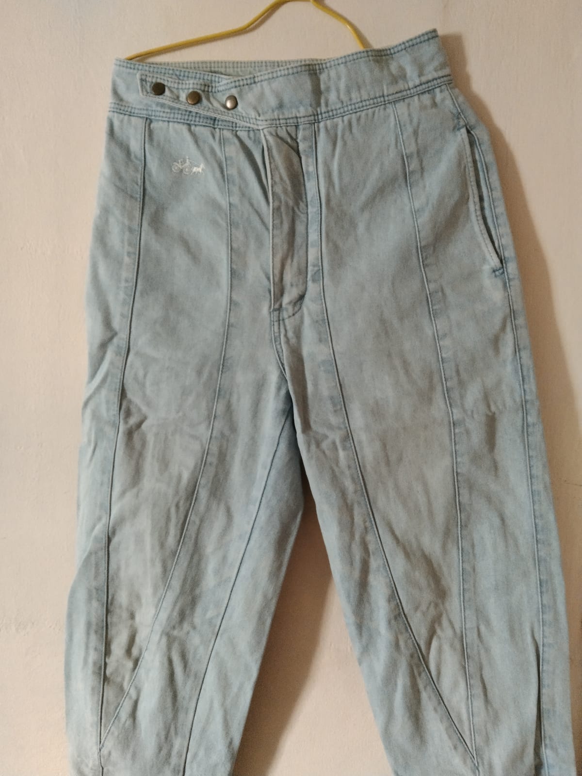 Chic Light Wash Denim Pants with Button Detailing