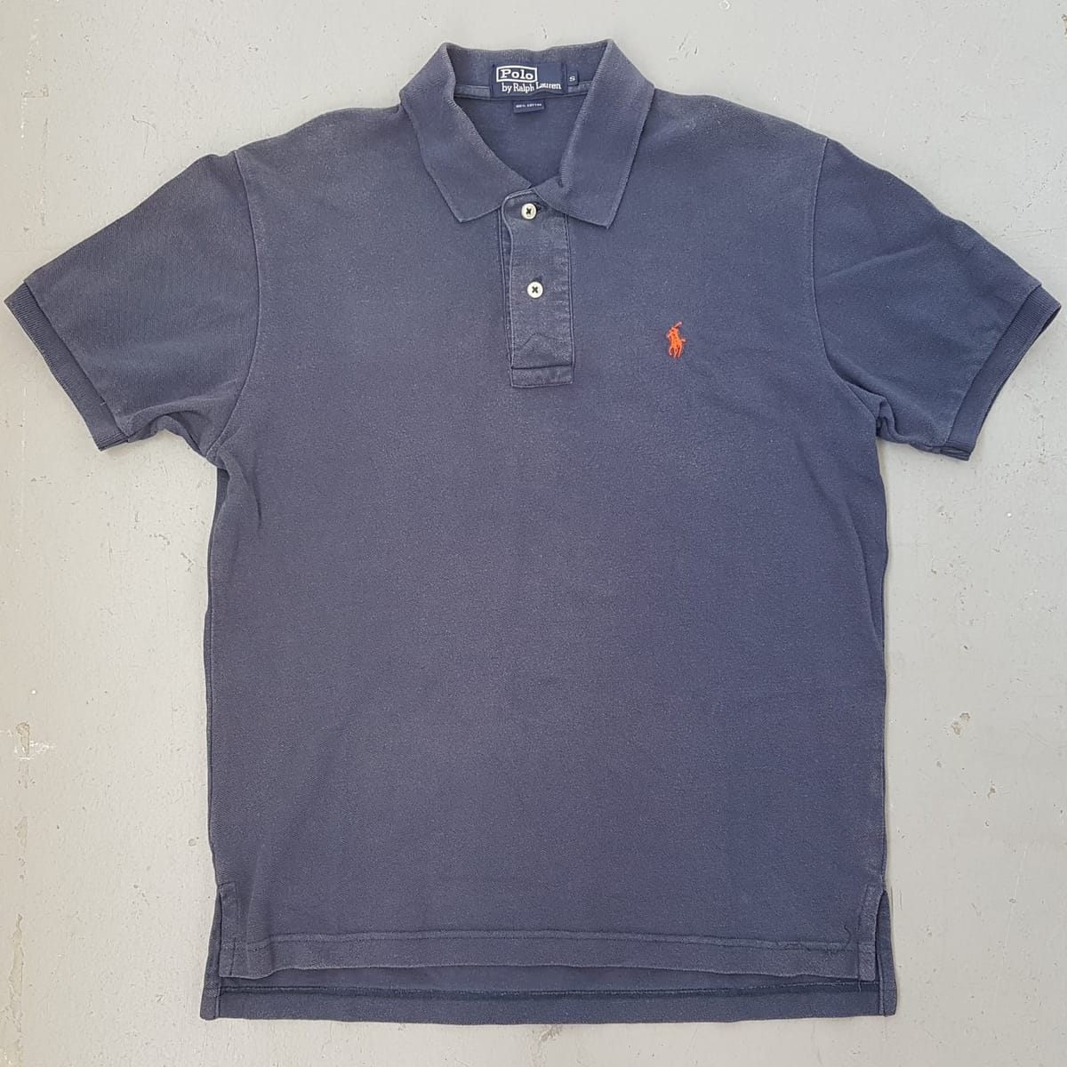 POLO by Ralph Lauren Designer Shirt, Original RL 2 Buttons Polo Shirt, Cosmopolitan, Retro Navy Blue Top, Orange Polo Logo, Luxury Lifestyle, Sleek Model, Urban Style, Sophistication, Streetwise, Vintage Apparel, Timeless Classic, Pop Culture, Cult Street Fashion