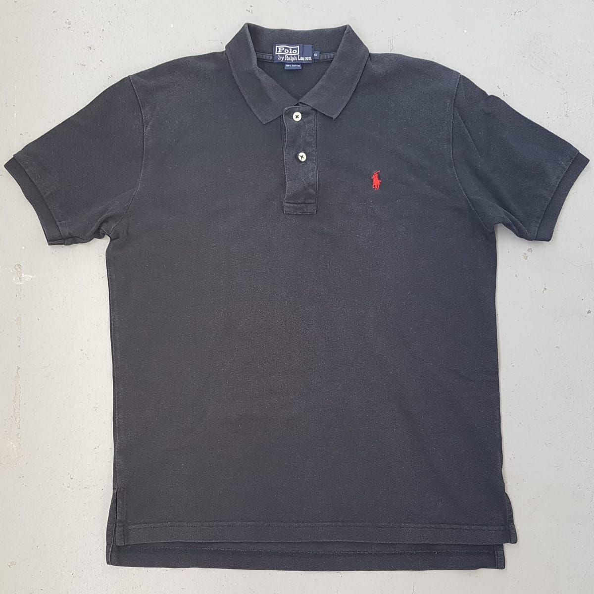 Ralph Lauren Original POLO by Ralph Lauren Designer Shirt, 2 Buttons Polo Shirt, Cosmopolitan, Retro Black Top, Red RL Polo Logo, Luxury Lifestyle, Sleek Model, Urban Style, Sophistication, Streetwise, Vintage Apparel, Timeless Classic, Pop Culture, Cult Street Fashion