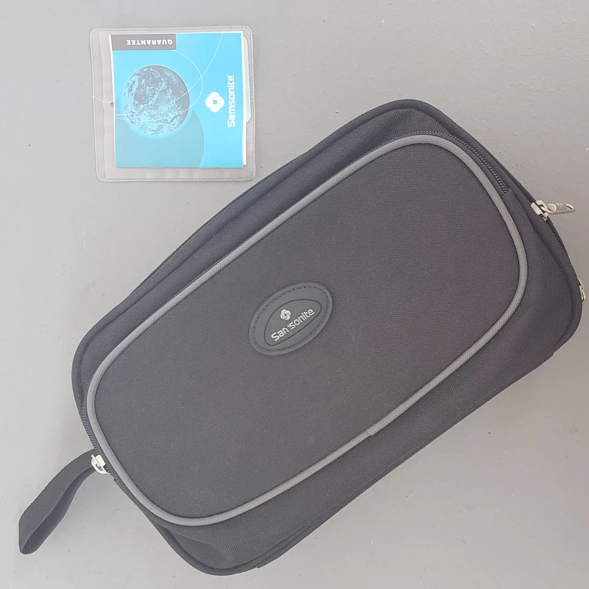 Original Samsonite 225 Series AIRSTOP Plus Lucid Pouch, Cool Black Clutch, Cosmopolitan, Intricate Design, Satchel Bag, Side Handle, Luxury Lifestyle, Travel Organizer, Pop Culture, Sophistication, Streetwise, Timeless Appeal, Cult Street Fashion