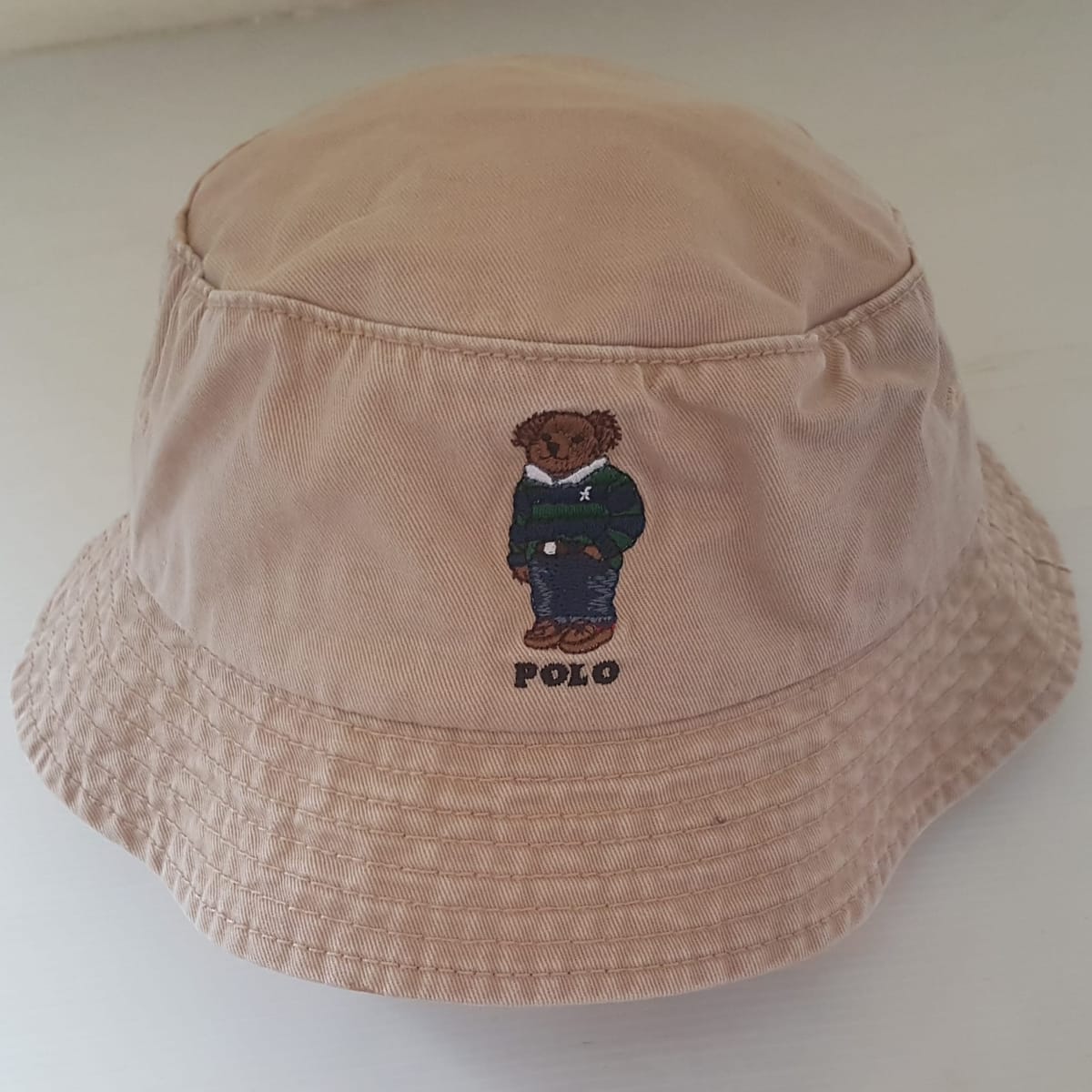 Retro Polo by Ralph Lauren Bucket Hat, Cool Khaki Top, Embroidered Polo Bear Model, Cosmopolitan, Luxury Living, Sleek Designer Headgear, Sophistication, Art Décor POLO Cap, Timeless Appeal, Pop Culture, Cult Street Fashion, Urban Style, Summer Holidays
