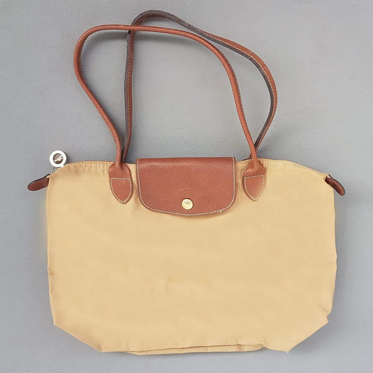 Original LONG CHAMP Tote Bag, Beige Longchamp Le Pliage Nylon Handbag, Shoulder Straps, Snap-Flap Closure, Cosmopolitan, Haute Couture, Luxury Handbag, Urban Style, Pop Culture, Sophistication, Streetwise, Your Everyday Bag