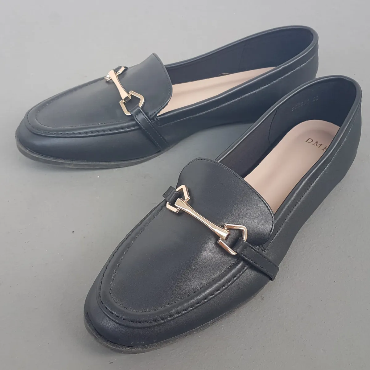 DMK Original DMK Enya Flat Loafers, Cosmopolitan, US 7, EUR 38, Cool Black Slip-on, Sliders, Work Shoes, Gold Ornamental Buckle, Sleek Designer Shoes, Comfortable, Sophistication, Pop Culture, Urban Style, Cult Street Fashion, Everyday Shoes, Timeless Appeal