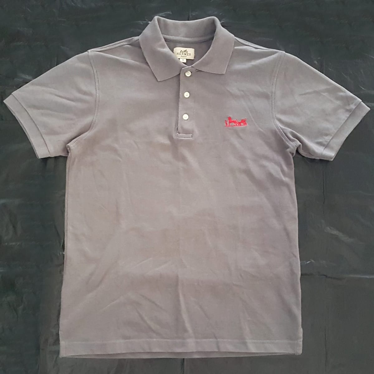 Hermès Paris Polo Shirt, Cool Gray Top, Red Hermès Logo, Cosmopolitan, Sleek 3 Buttons Polo Design, Luxury Lifestyle, Timeless Appeal, Urban Style, Sophistication, Streetwise, Pop Culture, Geek, Cult Street Fashion, Models, Runway, Catwalk