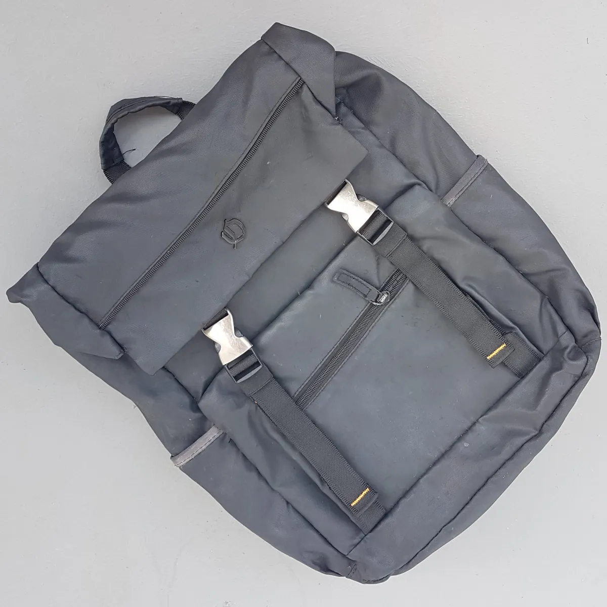 Exclusive OGIO Backpack, Grayish Black Haversack, Cool Nylon Fold-Over Flap Rucksack, Cosmopolitan, Dual Front Buckle, Laptop Bag, Padded Back, Sophistication, Streetwise, Pop Culture, Urban Style, Timeless Appeal, Everyday Fashion