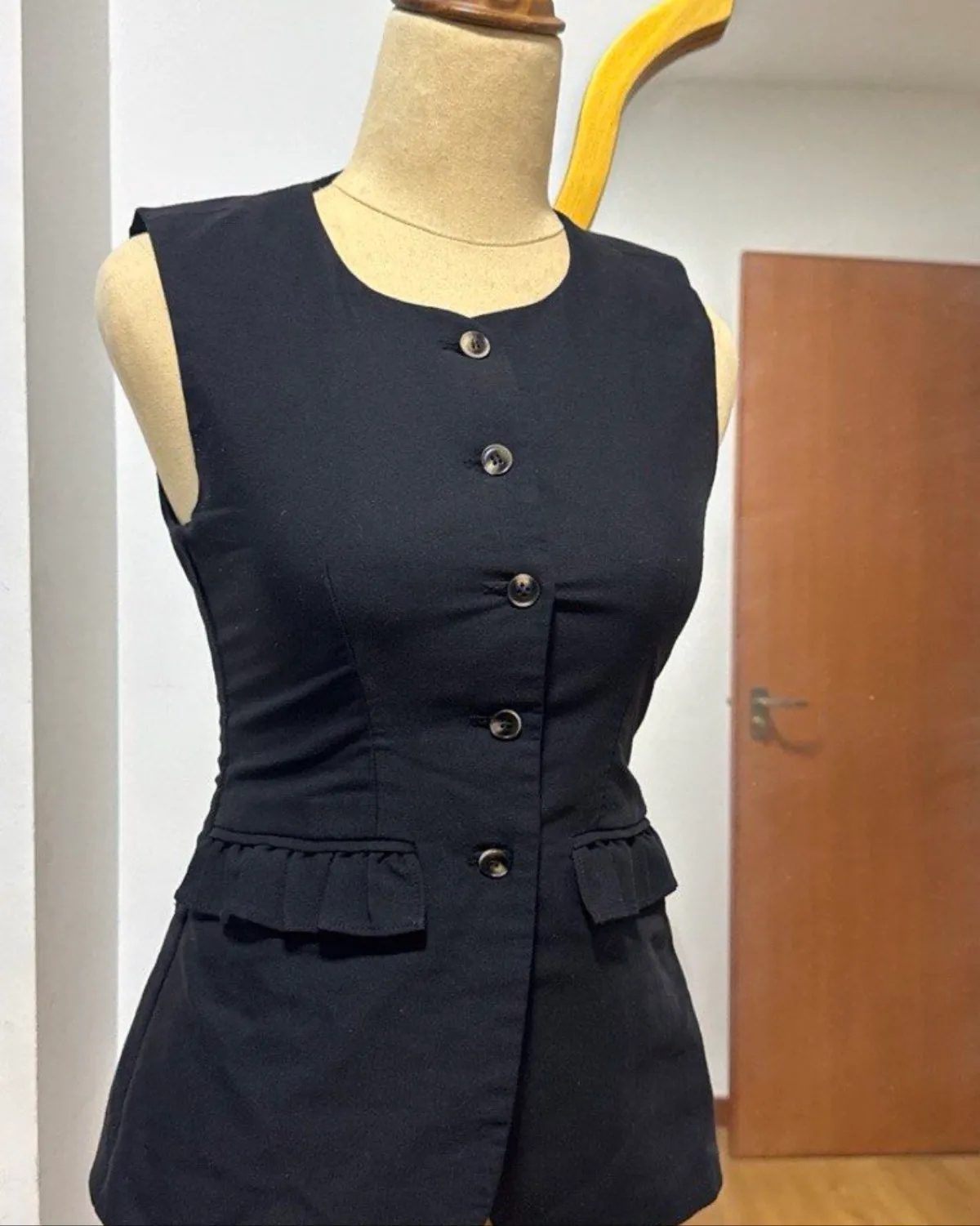 Black Button-Up Sleeveless Waistcoat with Peplum Detail